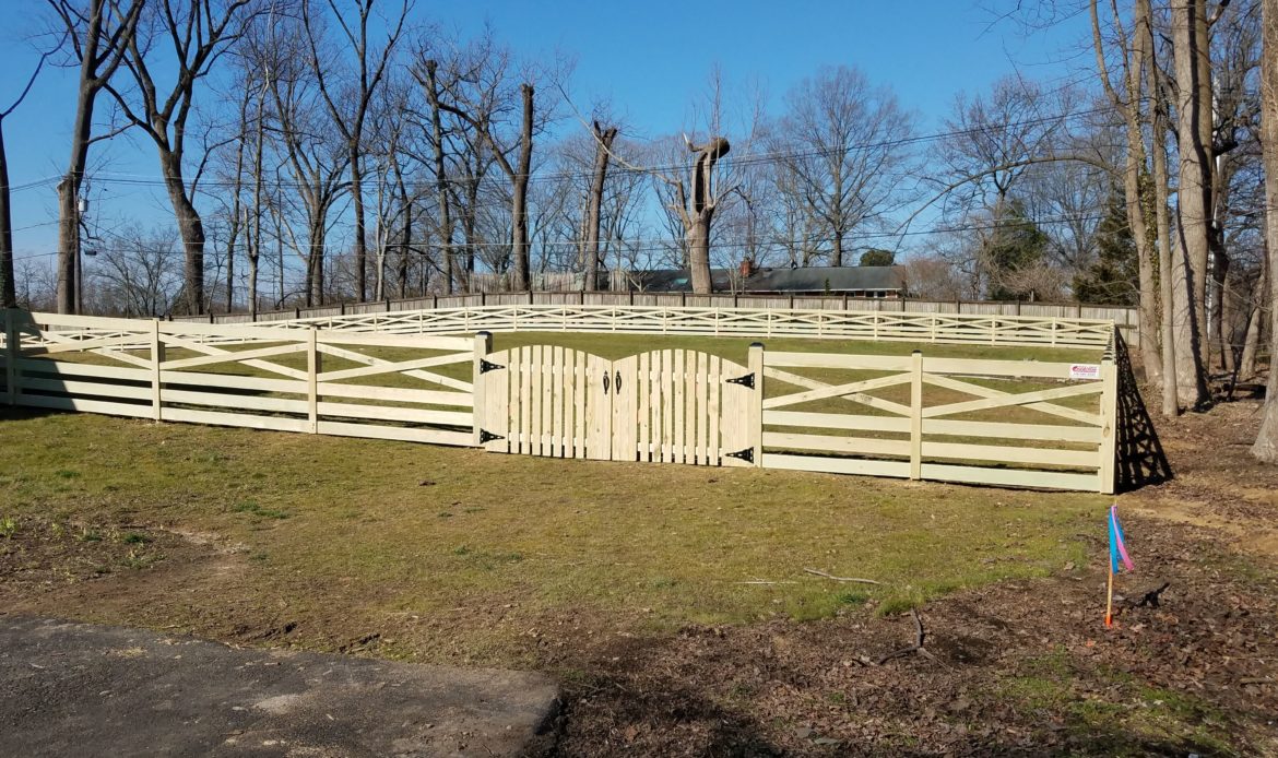 4 foot high pressure treated wood Crossbuck style fence with double arched gate