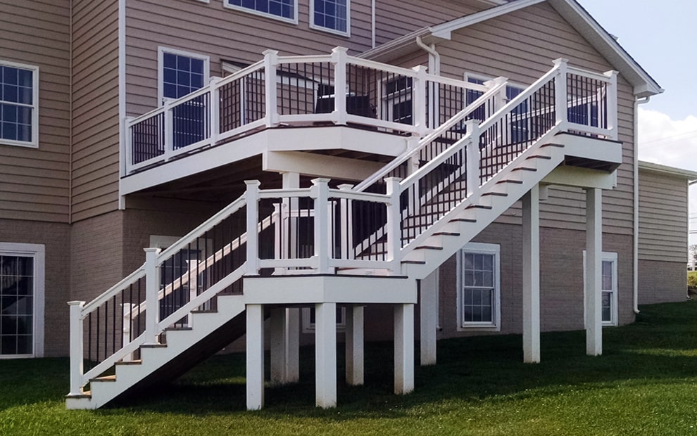 Deck Design - with white vinyl railing & black ballusters, facia board and wrapped beams & posts-min