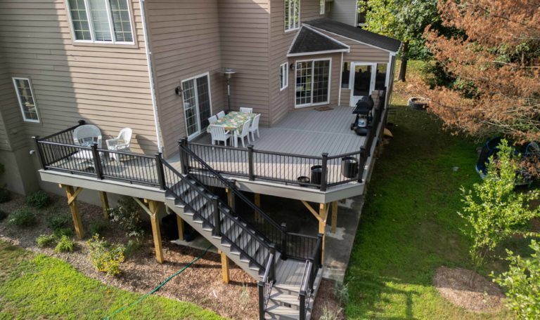 Main Deck Image - Deck Builder deck with gray deck boards and black aluminum railing - first image-min