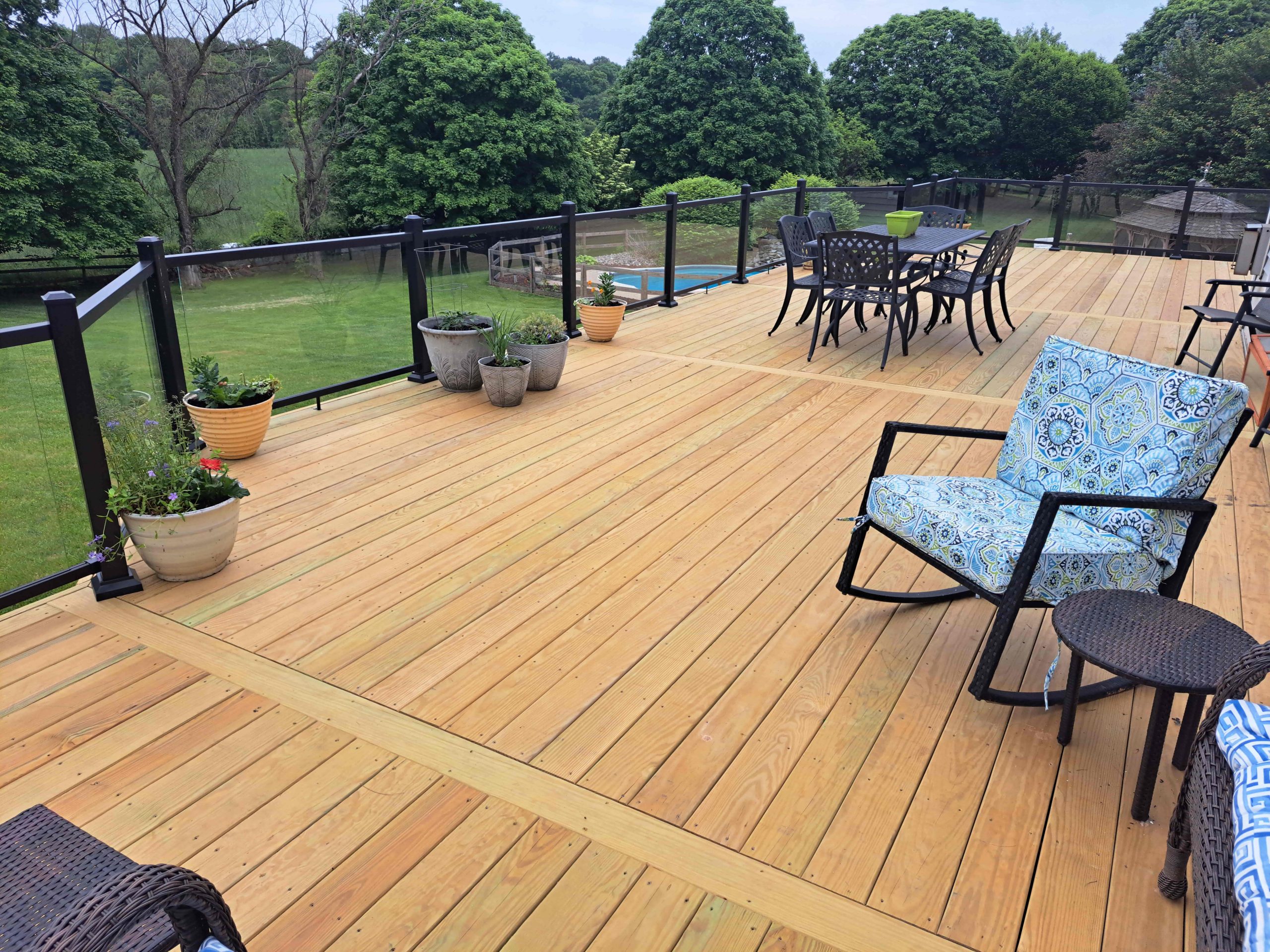 Main Photo - Wood Pressure Treated wood deck with aluminum railing with glass inserts-min