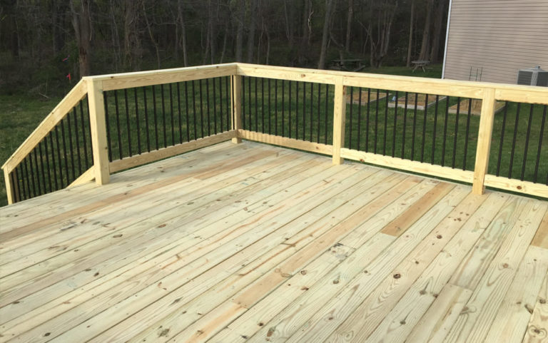 Pressure-Treated-Wood-deck-with-black-aluminum-baluster-railing.jpg