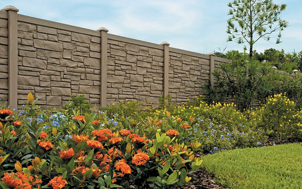 4 Brown Granite Ecostone Simtek Fence bordered by a flower bed