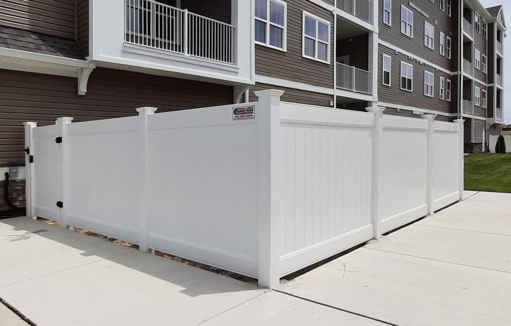 9 White Vinyl Privacy Fence with Single Walk Gate used to enclose utilities