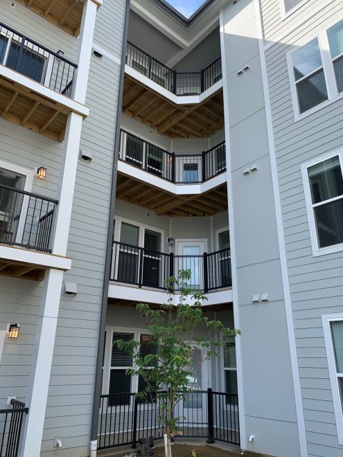 Black-Aluminum-Balcony-Railing-in-the-corner-of-the-courtyard-at-Monarch-at-Waugh-Chapel-in-MD