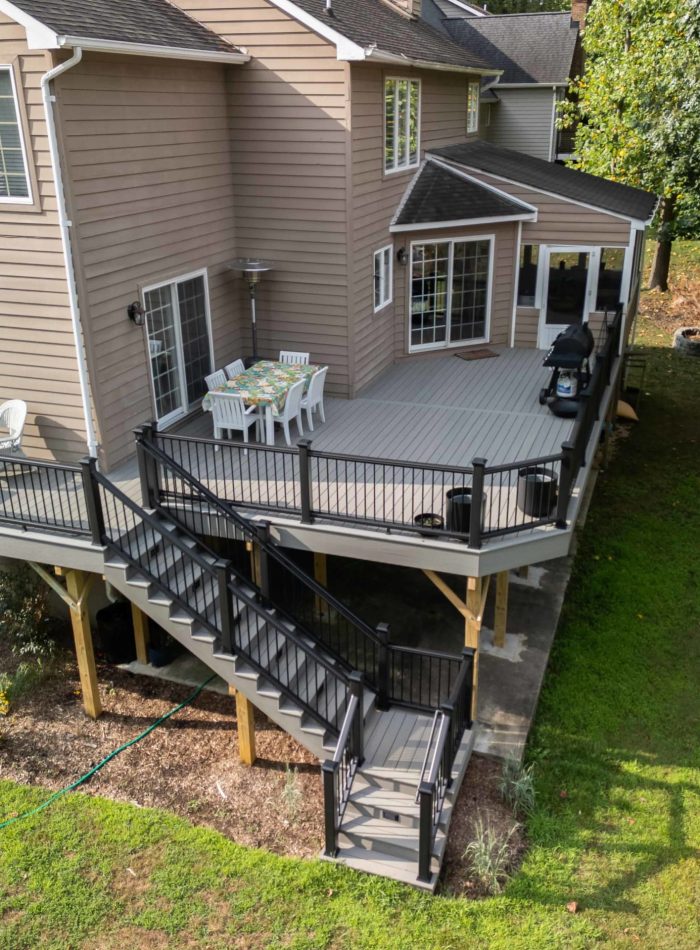 Main Deck Image - Deck Builder deck with gray deck boards and black aluminum railing - first image-min