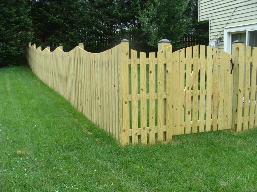 Spaced Picket Fence with a Concave Dip and an Arched Gate