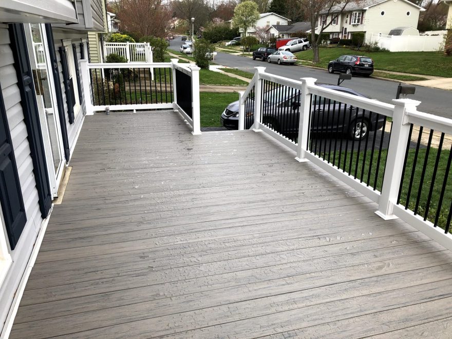 TimberTech Reserve Driftwood Decking with White Washington Railing with Black Aluminum Balusters - Front Porch in Gambrills MD