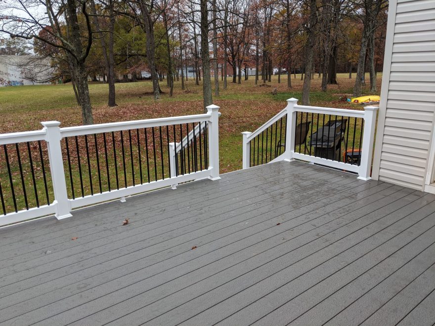 TimberTech Terrain Silver Maple Deck Boards with White Washington Vinyl Railing with Black Round Aluminum Balusters in Baltimore MD