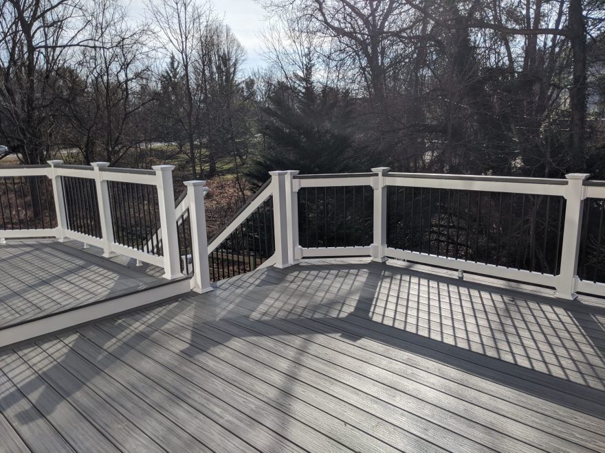 Trex Transcend Island Mist Deck Boards with White Vinyl Lincoln Railing with Black Round Aluminum Balusters and matching cocktail rail in Ellicott City MD