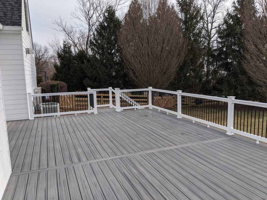 Trex Transcend Island Mist Deck Boards with White Washington Vinyl Railing and Black Round Aluminum Balusters in Glenwood, MD