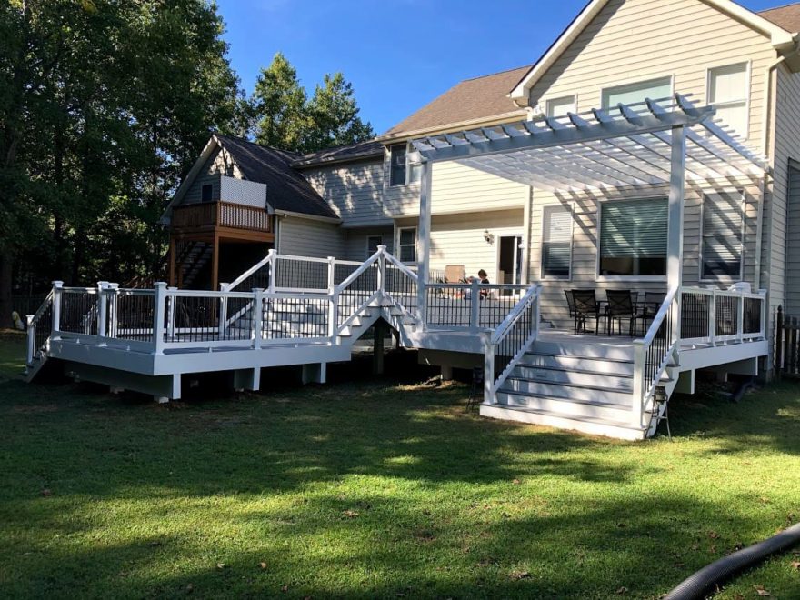 Trex Transcend Pebble Gray Decking with White Washington Vinyl Railing + Black Round Aluminum Balusters + Pergola in Annapolis MD