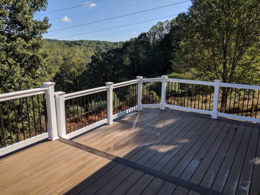 Two Level Trex Transcend Havana Gold Decking + Spiced Rum Feature Board with White Washington Vinyl Railing and Hammered Bronze Balusters