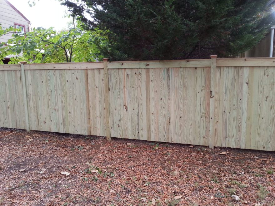 Vertical Board Wood Privacy Fence with Fascia Board Top and New England Caps 2